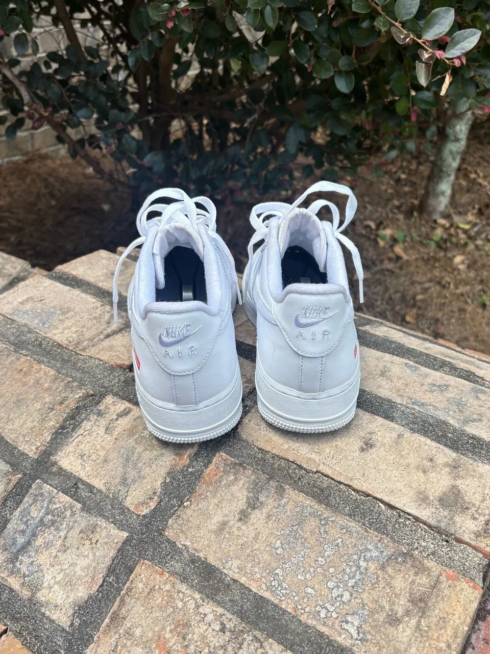 Nike White Low-Top Leather Sneaker with Red Supreme Box Logo